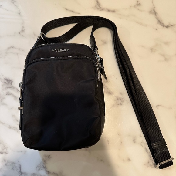 Tumi Handbags - Tumi cross body never worn.